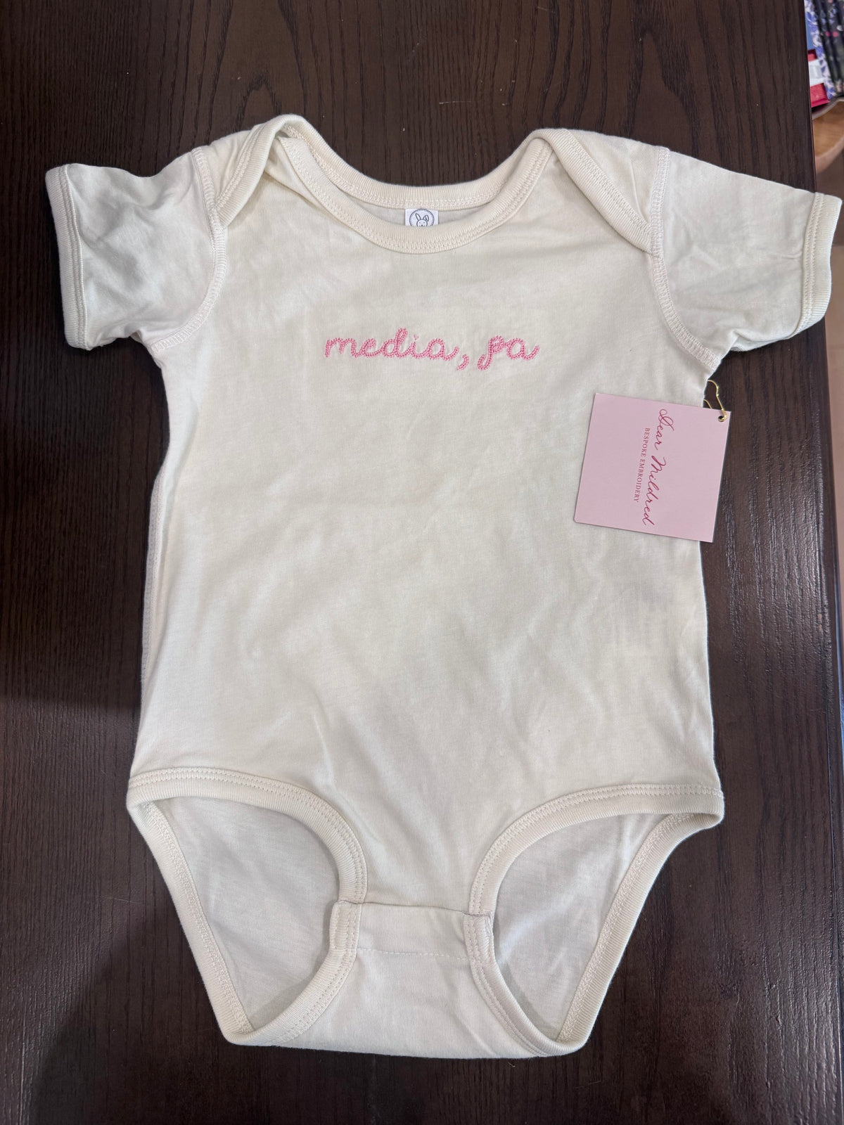 Media baby onesie