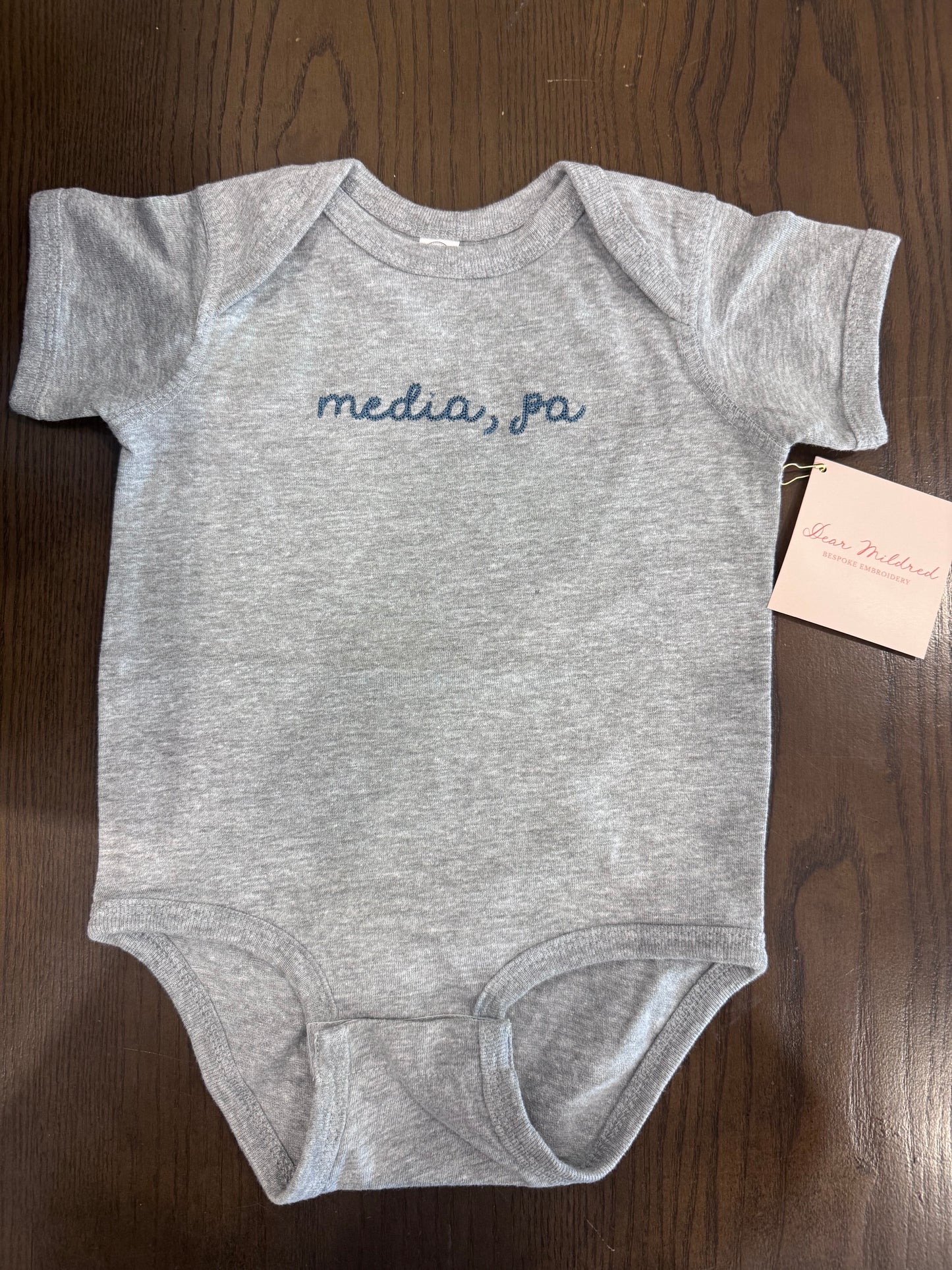 Media baby onesie